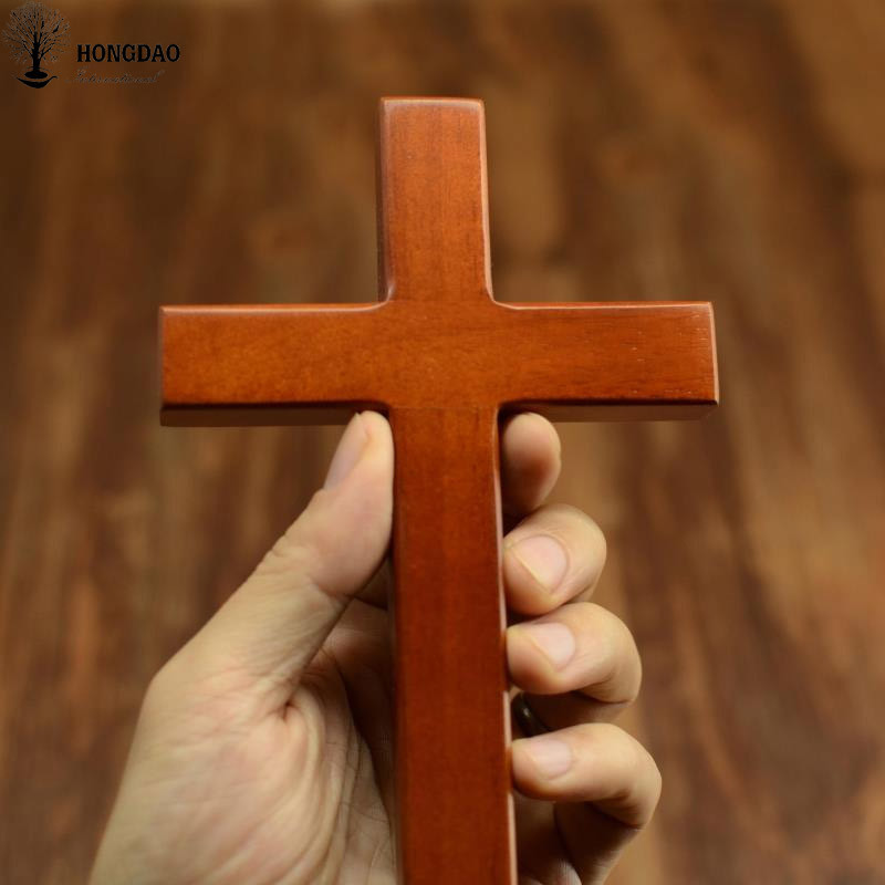 China Small Size Holding Hand Carved Wooden Crosses , Comfort Wooden Crucifix wholesale
