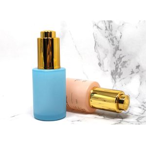 China Empty Custom Blue Frosted Push Button Serum Dropper Bottle With Lids wholesale