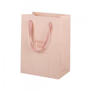 China Eco Friendly Pink Paper Packaging Bags For Cosmetic With Ribbon Handle on sale