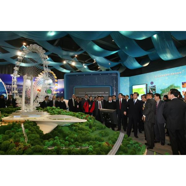 Architectural Model of Futuristic Glass Skyscraper with Illuminated Facade and Mixed-Use Complex