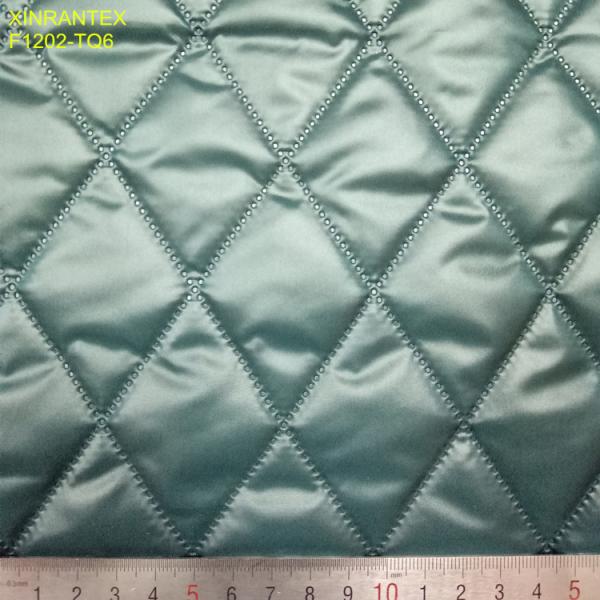 F1507-TQ1 ultrasonic embossing laminating 100% polyester termo qualiting fabric for winter heavy downcoat