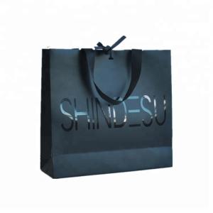 China Customized Logo Printed Paper Merchandise Bags Luxury High Bearing Capacity wholesale