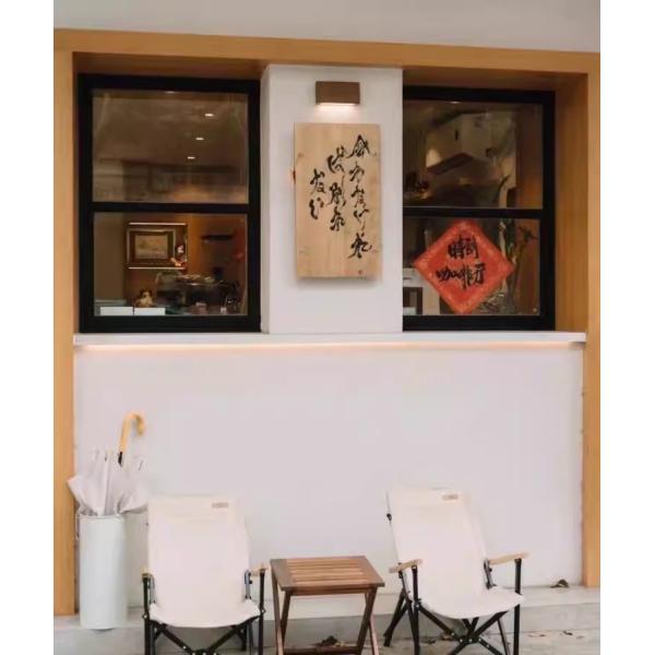 Patio-Integrated Folding Window System Enabling Effortless Entertaining Transitions Between Kitchen and BBQ Areas