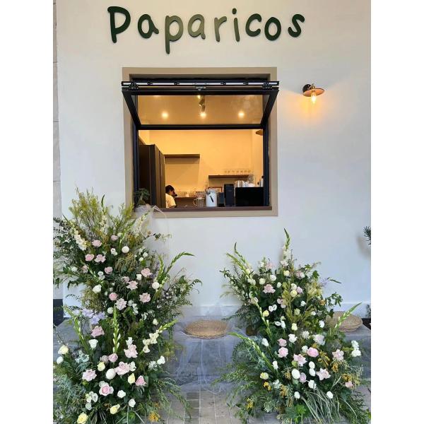 Patio-Integrated Folding Window System Enabling Effortless Entertaining Transitions Between Kitchen and BBQ Areas