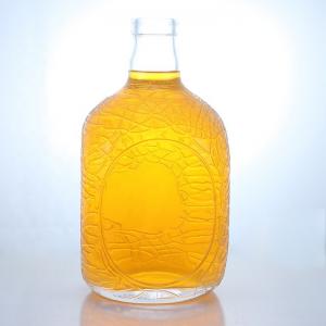 China Unique Round Shape Embossed Food Grade Rum Vodka Whisky Tequila Gin Glass Bottle with Cork Perfect wholesale