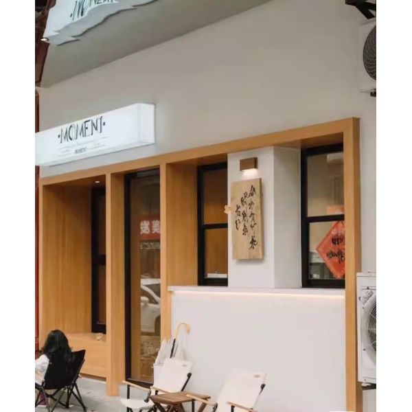 Patio-Integrated Folding Window System Enabling Effortless Entertaining Transitions Between Kitchen and BBQ Areas