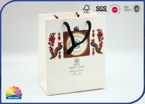 China 190gsm Solid Colored Art Paper Gift Bag With Ribbon Handle For Christmas Treat Bags wholesale