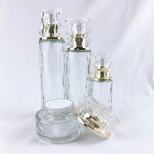 China 50ml 100ml Cosmetic empty glass jar with gold cap wholesale