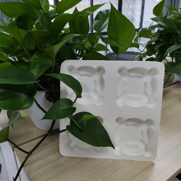 Made in China. The pulp-molded anti-shake base for takeaway coffee is environmentally friendly and biodegradable, and complies with the plastic ban.